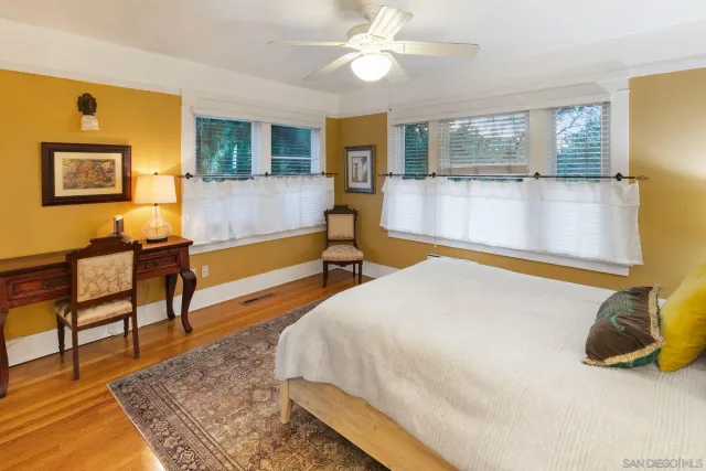 a spacious bathroom with a double vanity sink a mirror and a shower