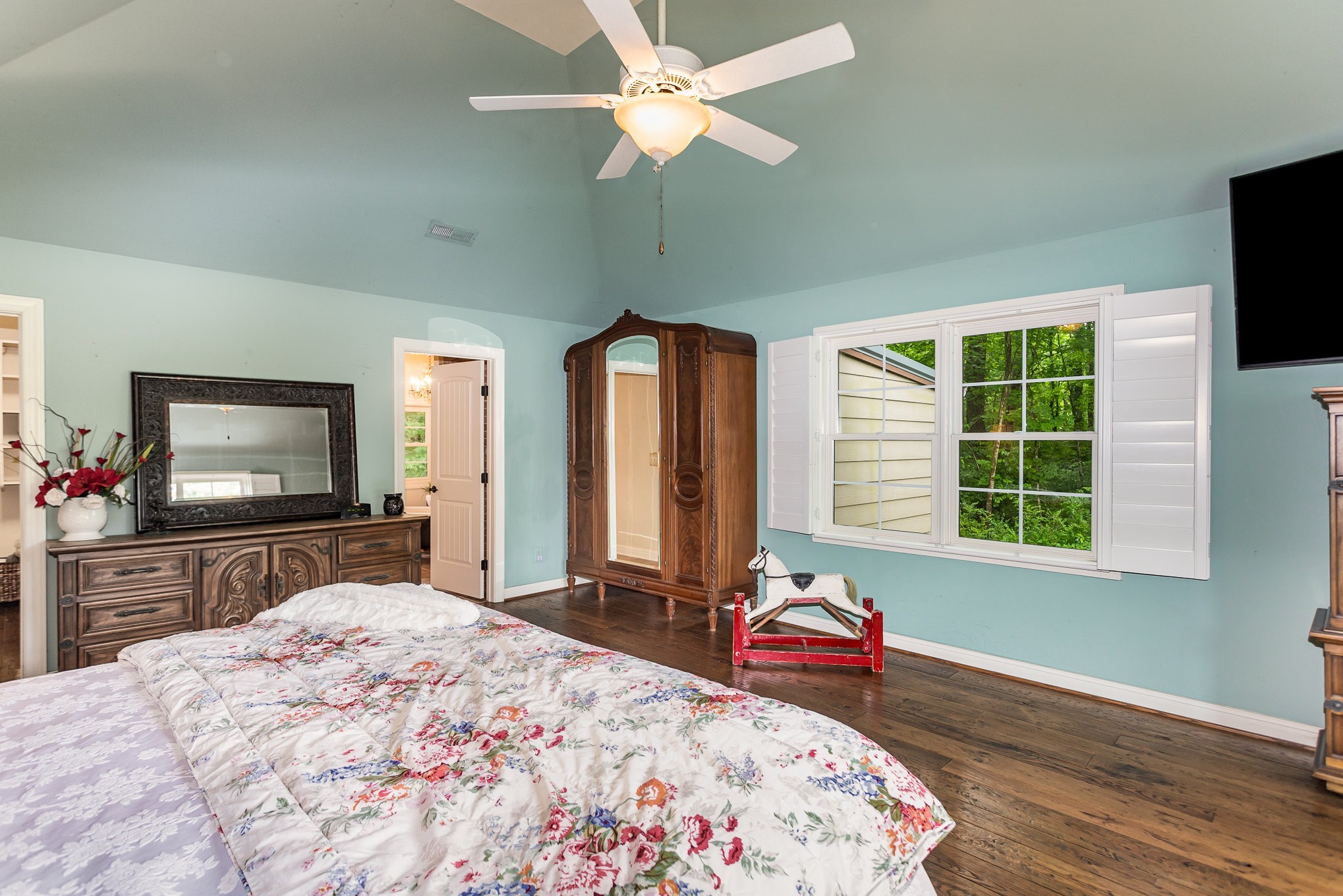 884 Pinnacle Hill Road Kingston Springs, TN 37082 - Photo 22 of 55 a bedroom with a bed and a flat screen tv