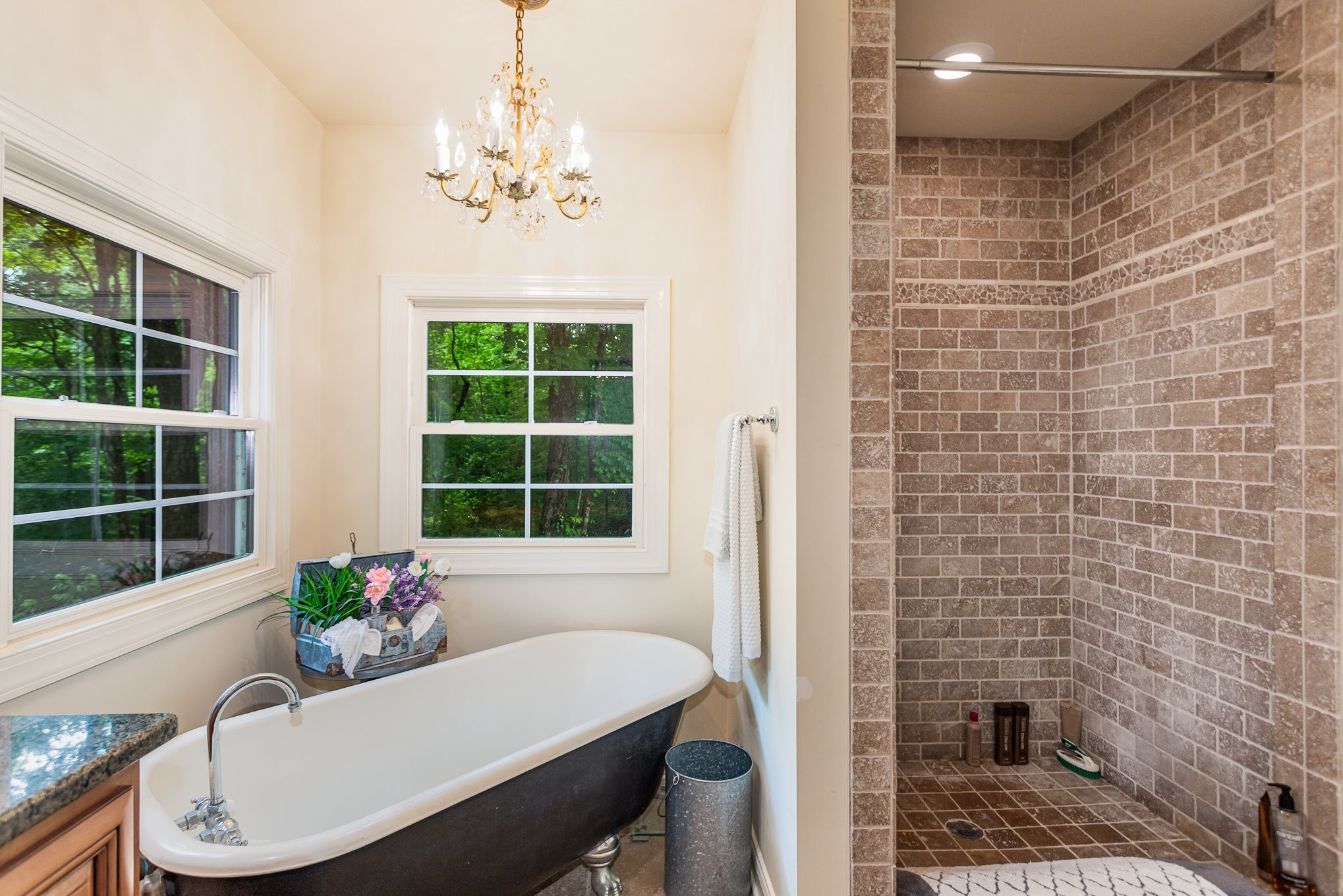 884 Pinnacle Hill Road Kingston Springs, TN 37082 - Photo 25 of 55 a view of a dining room with furniture wooden floor and a chandelier