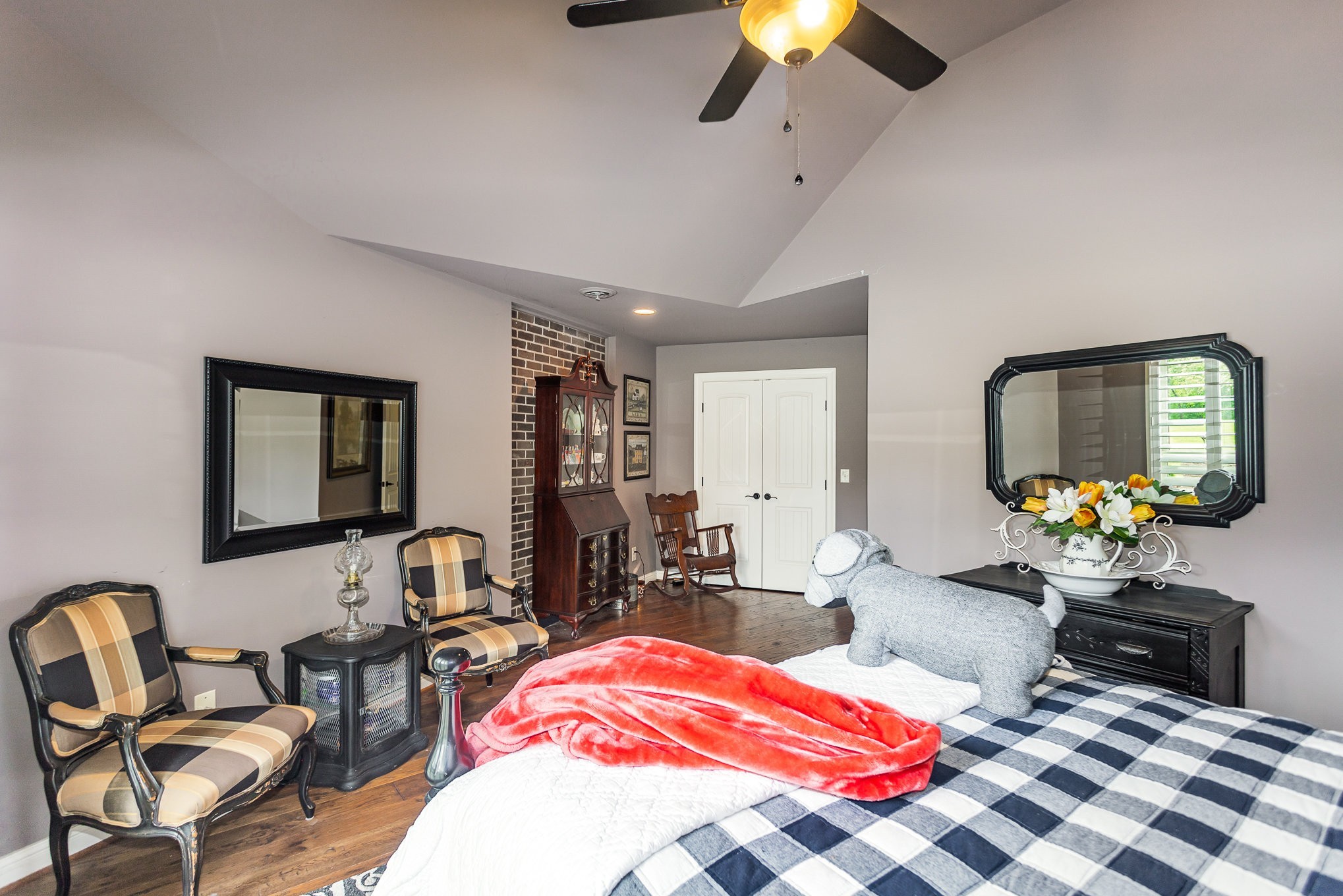 884 Pinnacle Hill Road Kingston Springs, TN 37082 - Photo 27 of 55 a bedroom with furniture and a chandelier