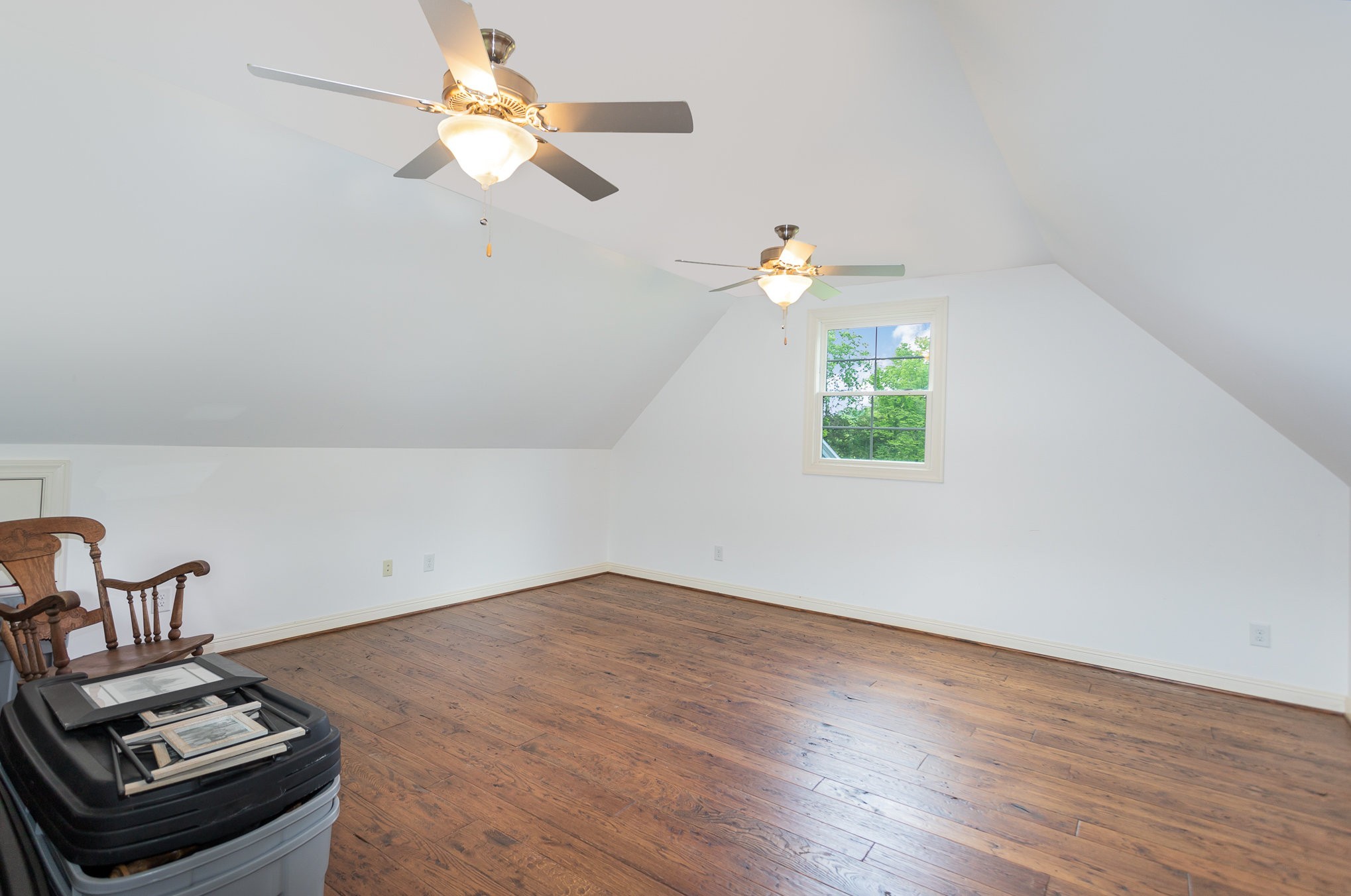 884 Pinnacle Hill Road Kingston Springs, TN 37082 - Photo 30 of 55 a bedroom with a bed and a chandelier