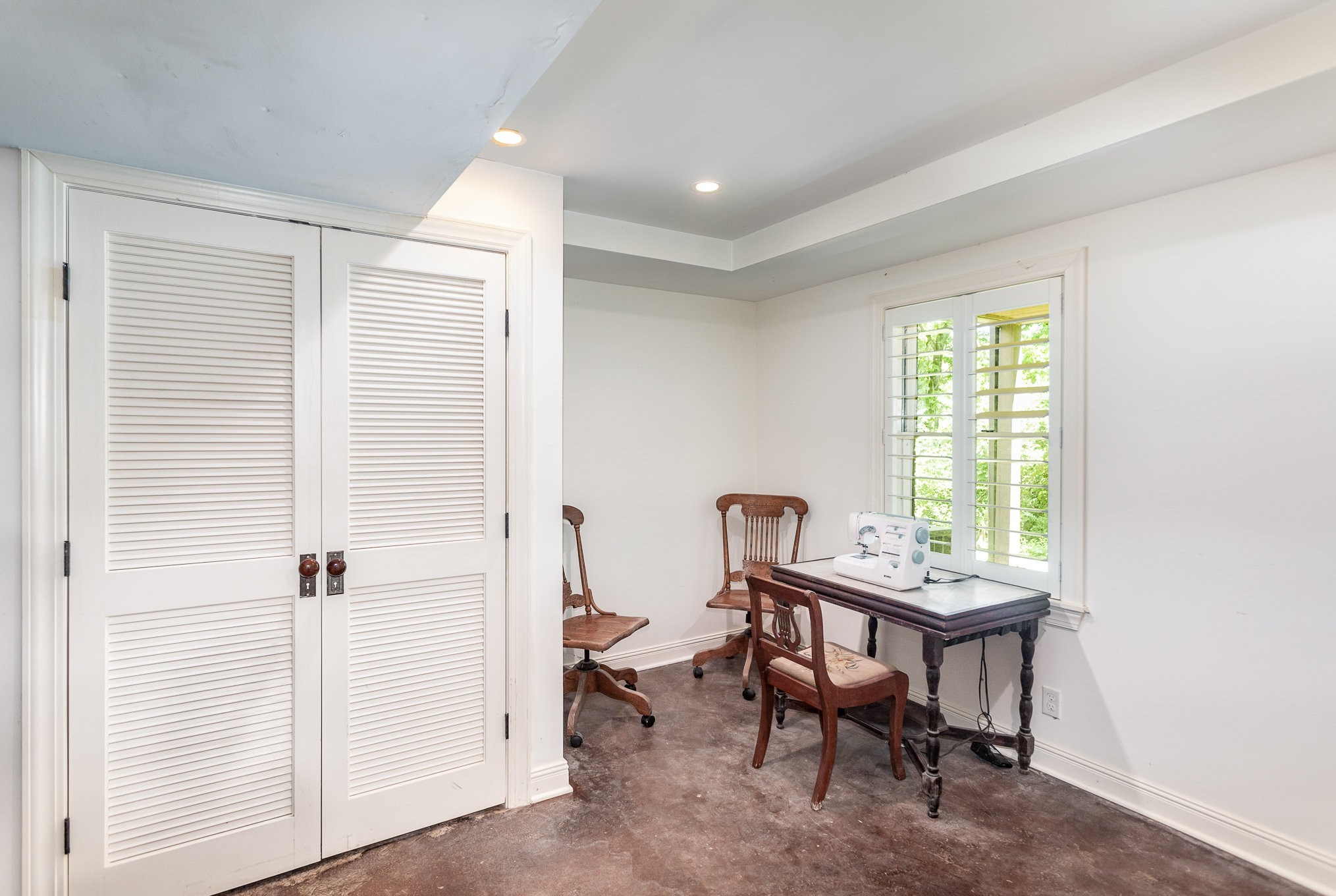 884 Pinnacle Hill Road Kingston Springs, TN 37082 - Photo 34 of 55 a view of a workspace with furniture and a window