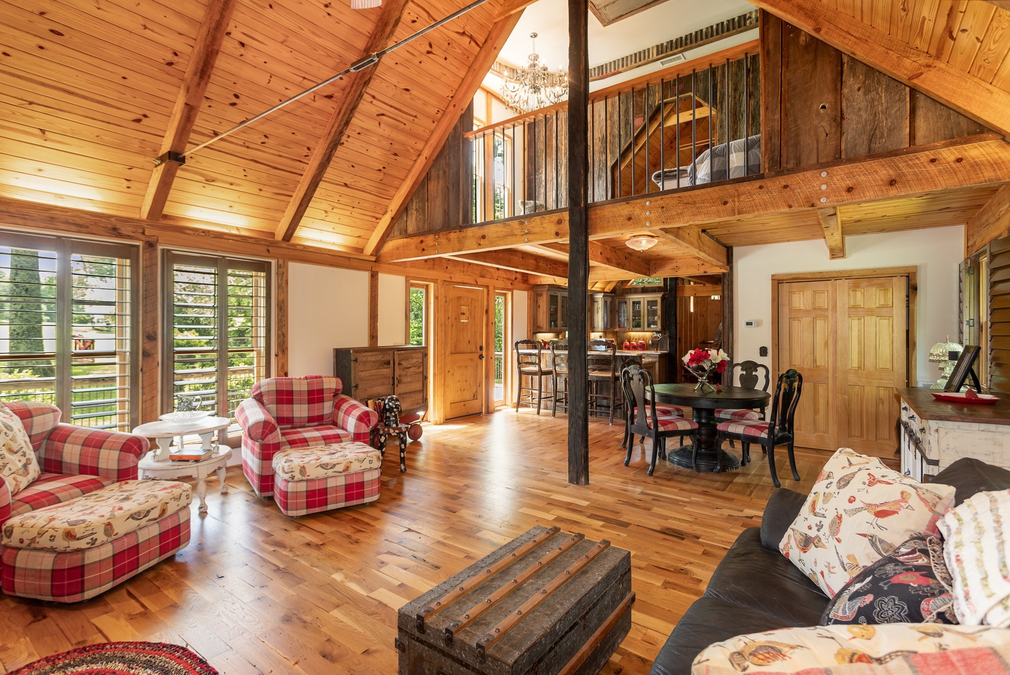 884 Pinnacle Hill Road Kingston Springs, TN 37082 - Photo 37 of 55 a living room with furniture a rug and a floor to ceiling window