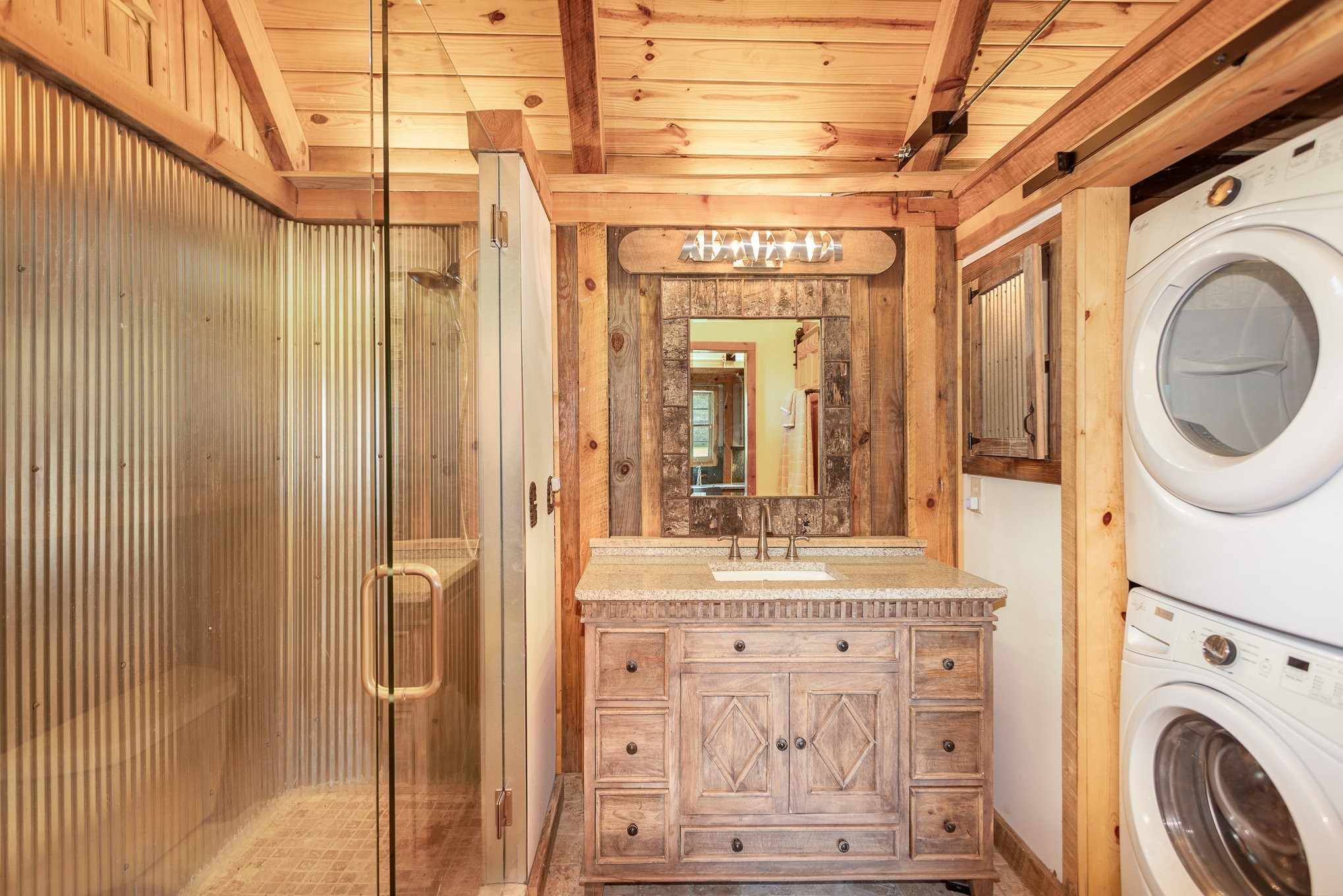 884 Pinnacle Hill Road Kingston Springs, TN 37082 - Photo 42 of 55 a view of a bathroom with washing machine and mirror