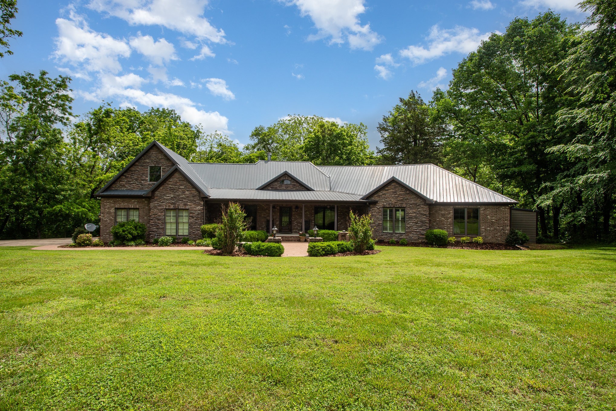 884 Pinnacle Hill Road Kingston Springs, TN 37082 - Photo 45 of 55 a front view of a house with yard and green space