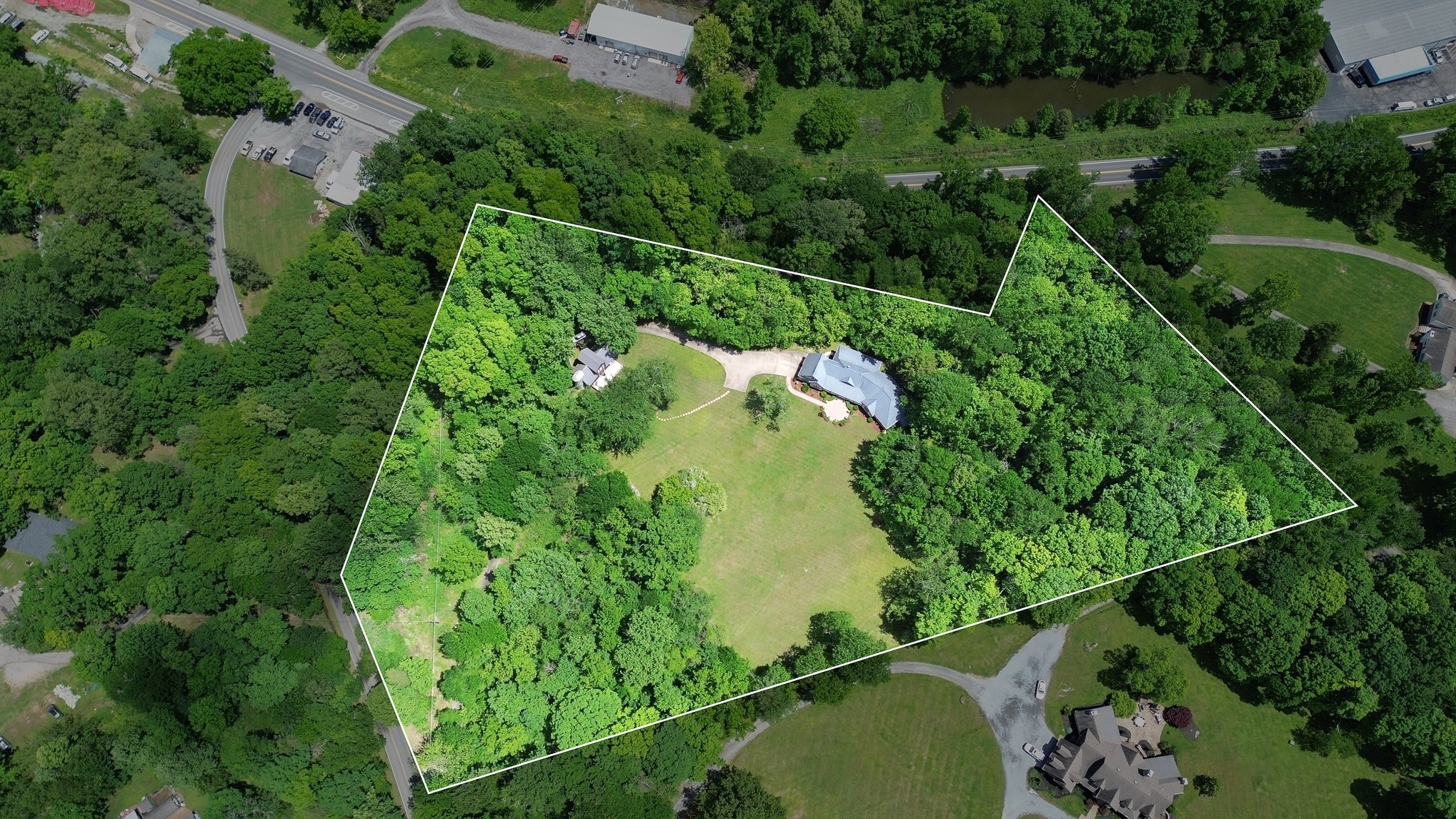 884 Pinnacle Hill Road Kingston Springs, TN 37082 - Photo 49 of 55 an aerial view of a residential houses with outdoor space and trees all around