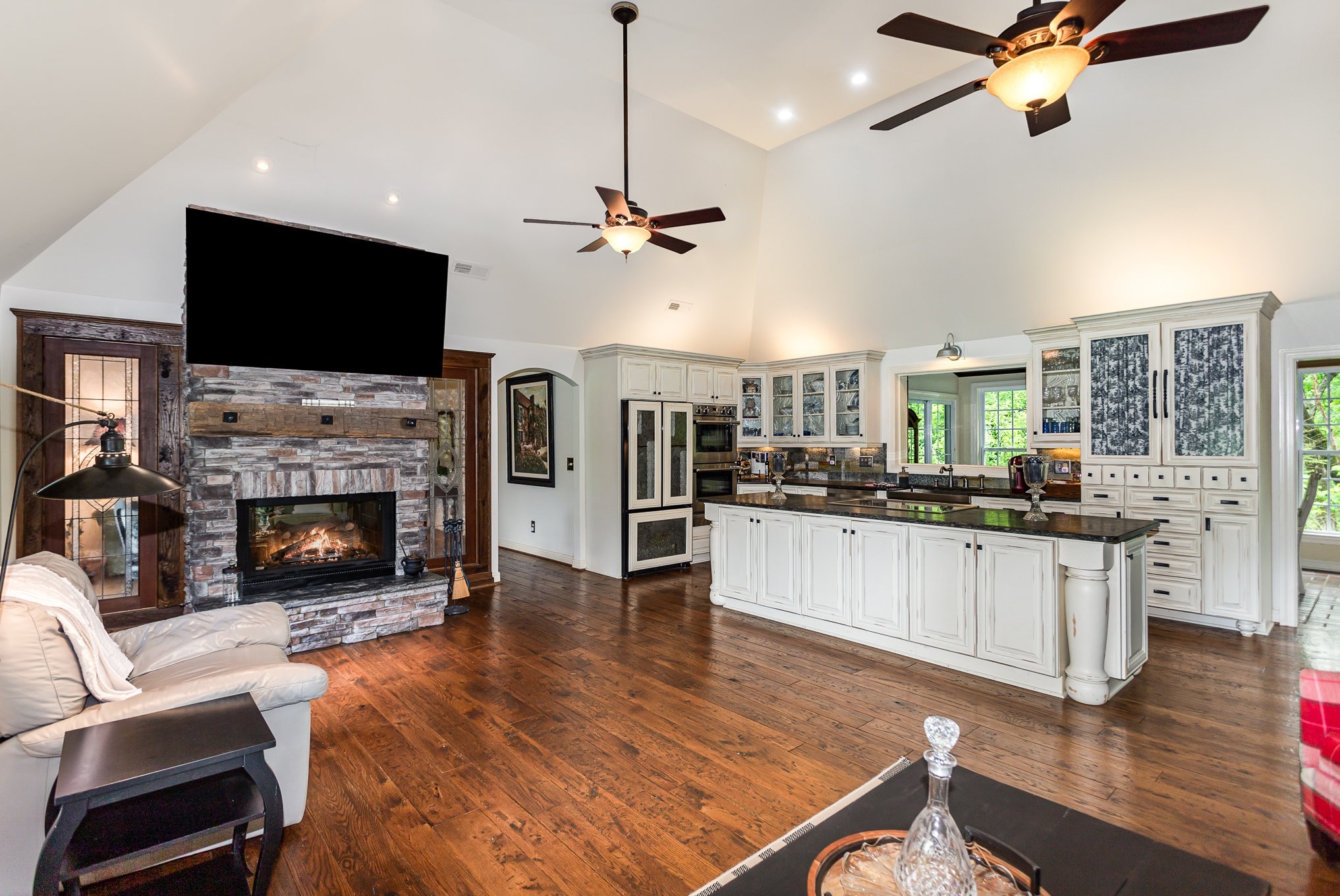 884 Pinnacle Hill Road Kingston Springs, TN 37082 - Photo 5 of 55 a living room with stainless steel appliances furniture fireplace and flat screen tv