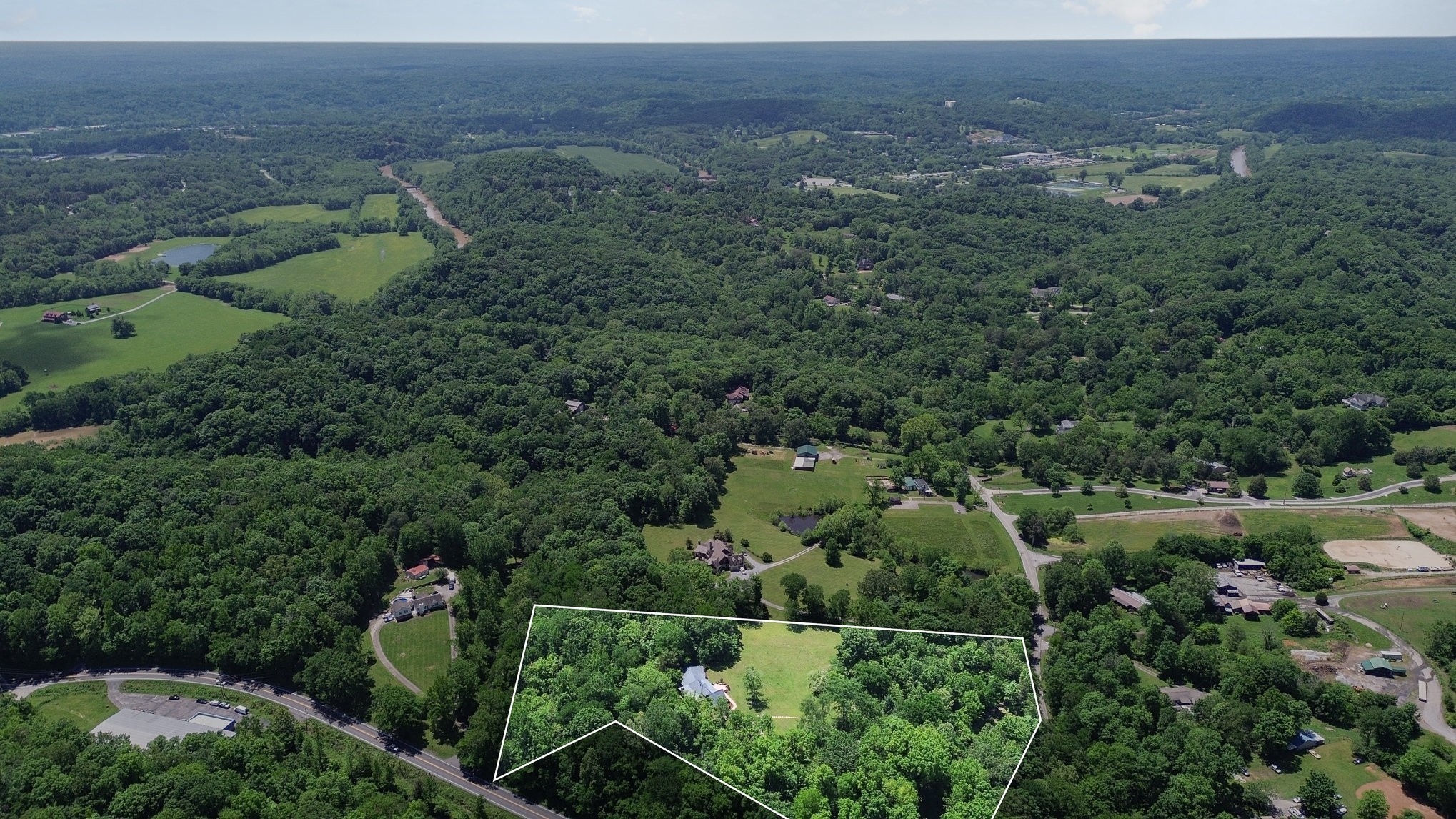 884 Pinnacle Hill Road Kingston Springs, TN 37082 - Photo 51 of 55 an aerial view of a house with a yard
