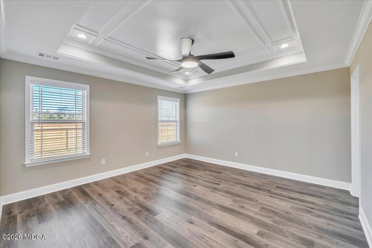 104 Early Drive Byron, GA 31008 - Photo 27 of 58 a view of an empty room with wooden floor and a window