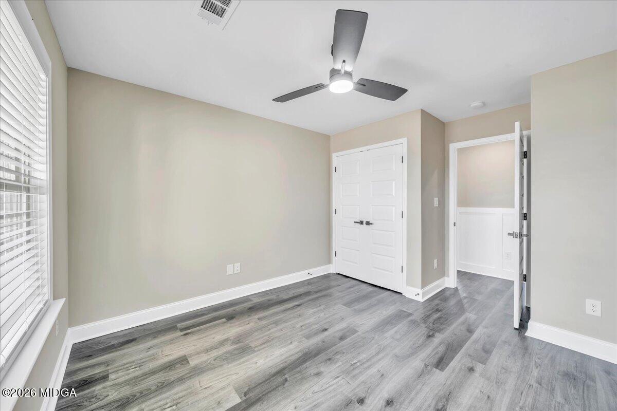 104 Early Drive Byron, GA 31008 - Photo 45 of 58 an empty room with wooden floor fan and windows