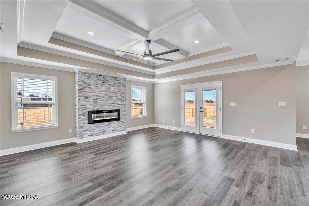 104 Early Drive Byron, GA 31008 - Photo 10 of 58 a view of an empty room with wooden floor and a window