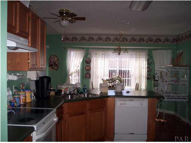 6755 Cedar Ridge Circle Milton, FL 32570 - Photo 6 of 13 Kitchen looking toward breakfast nook, with bay window on back of home.