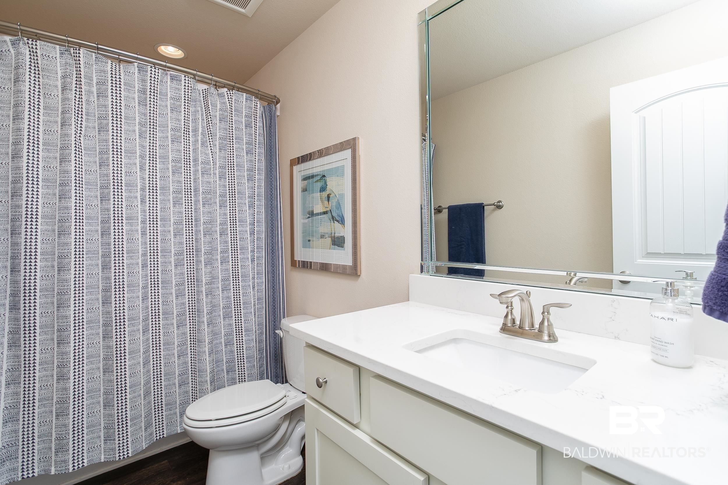 13154 Vincent Court Foley, AL 36535 - Photo 28 of 41 Full bath with a shower with curtain, toilet, and vanity