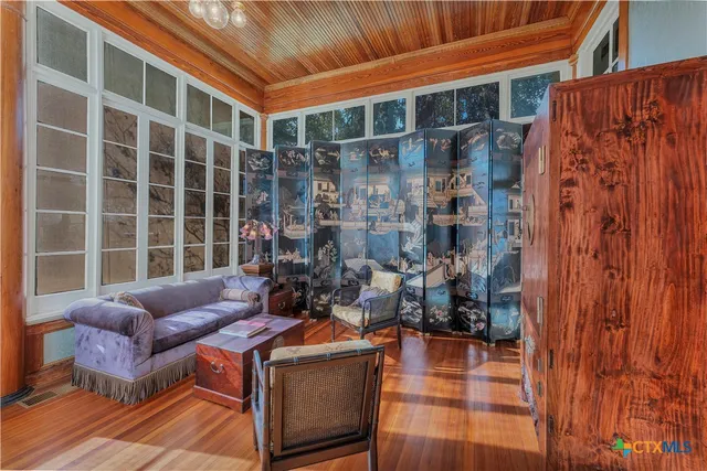 a outdoor living space with patio furniture and a garden