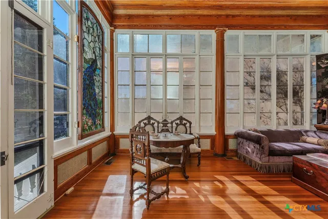 a balcony view with a seating space