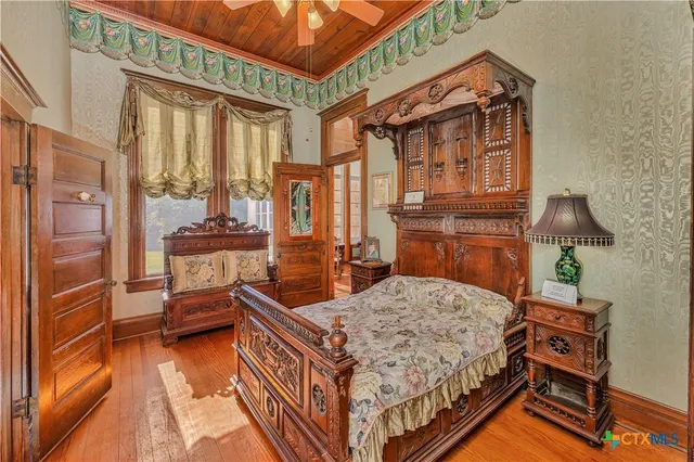 a bed room with a bed and a window