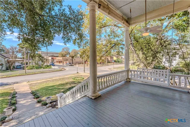 a view of a porch with wooden floor