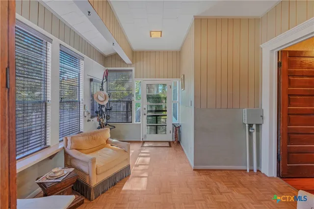 a bed room with furniture and a window