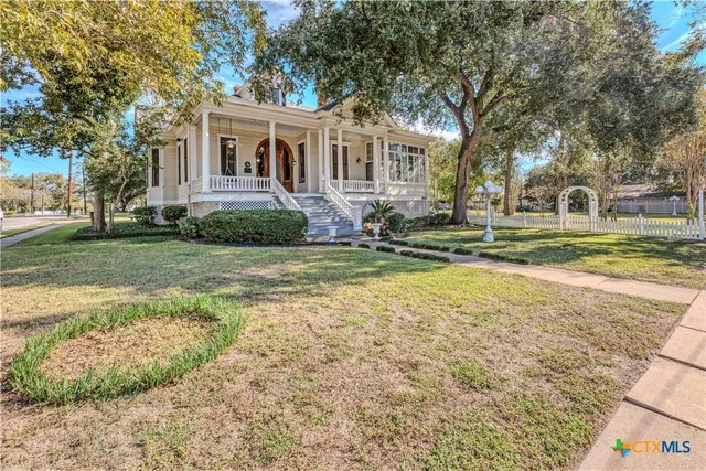 a view of a yard with swimming pool