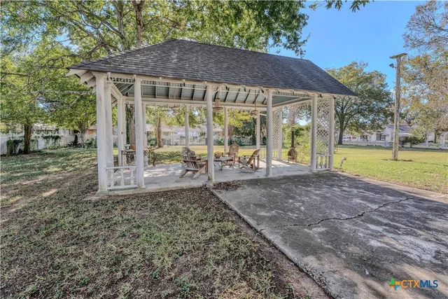 a view of a house with a yard and garage