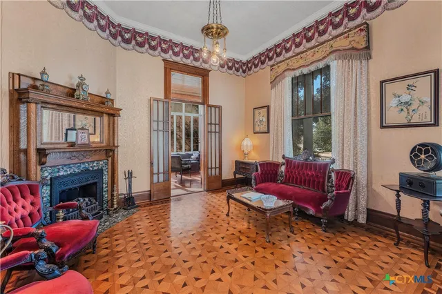 a living room with furniture or couch and a fireplace