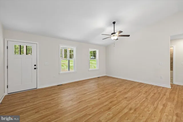 a kitchen with stainless steel appliances wooden cabinets and a stove top oven