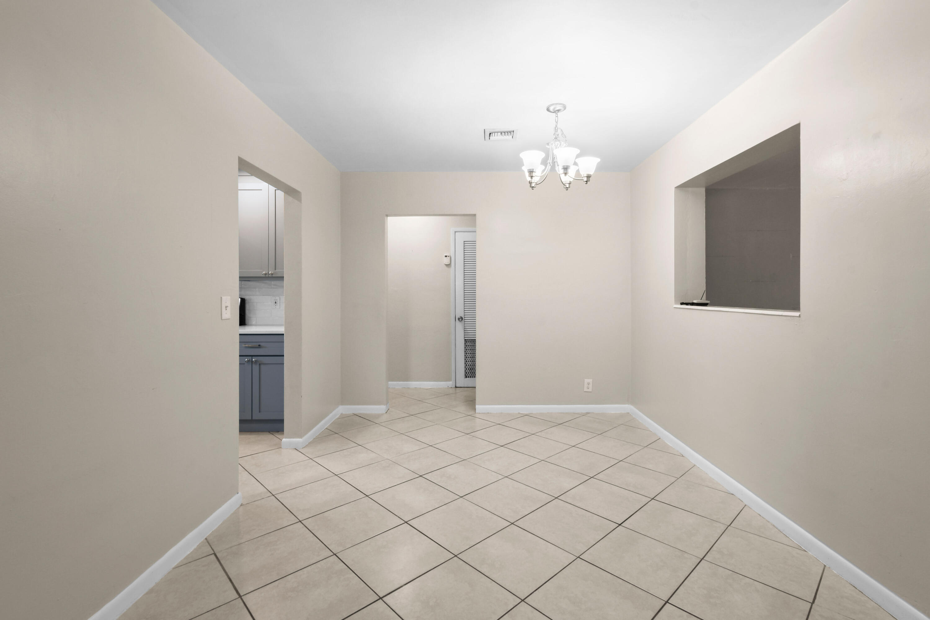 356 Cedar Avenue Tequesta, FL 33469 - Photo 12 of 51 an empty room with chandelier fan