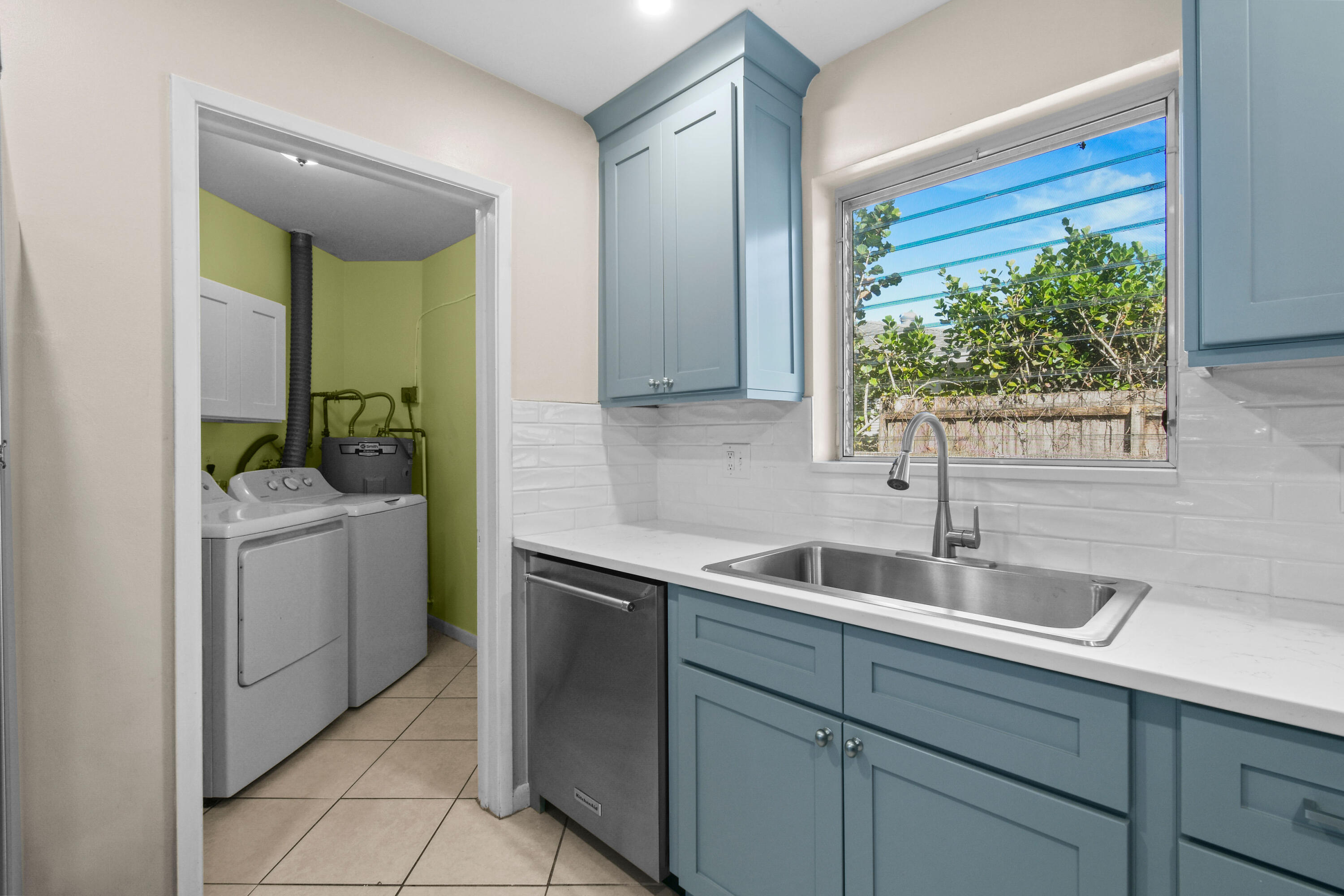 356 Cedar Avenue Tequesta, FL 33469 - Photo 17 of 51 a kitchen with a sink and a toilet