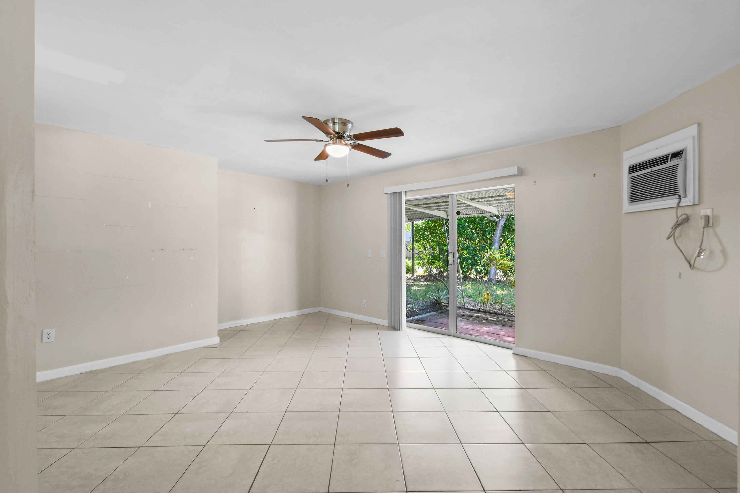 356 Cedar Avenue Tequesta, FL 33469 - Photo 20 of 51 a view of an empty room with a window