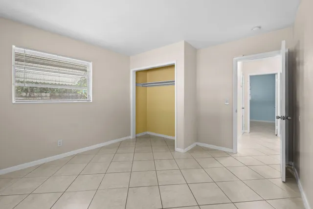 an empty room with a mirror