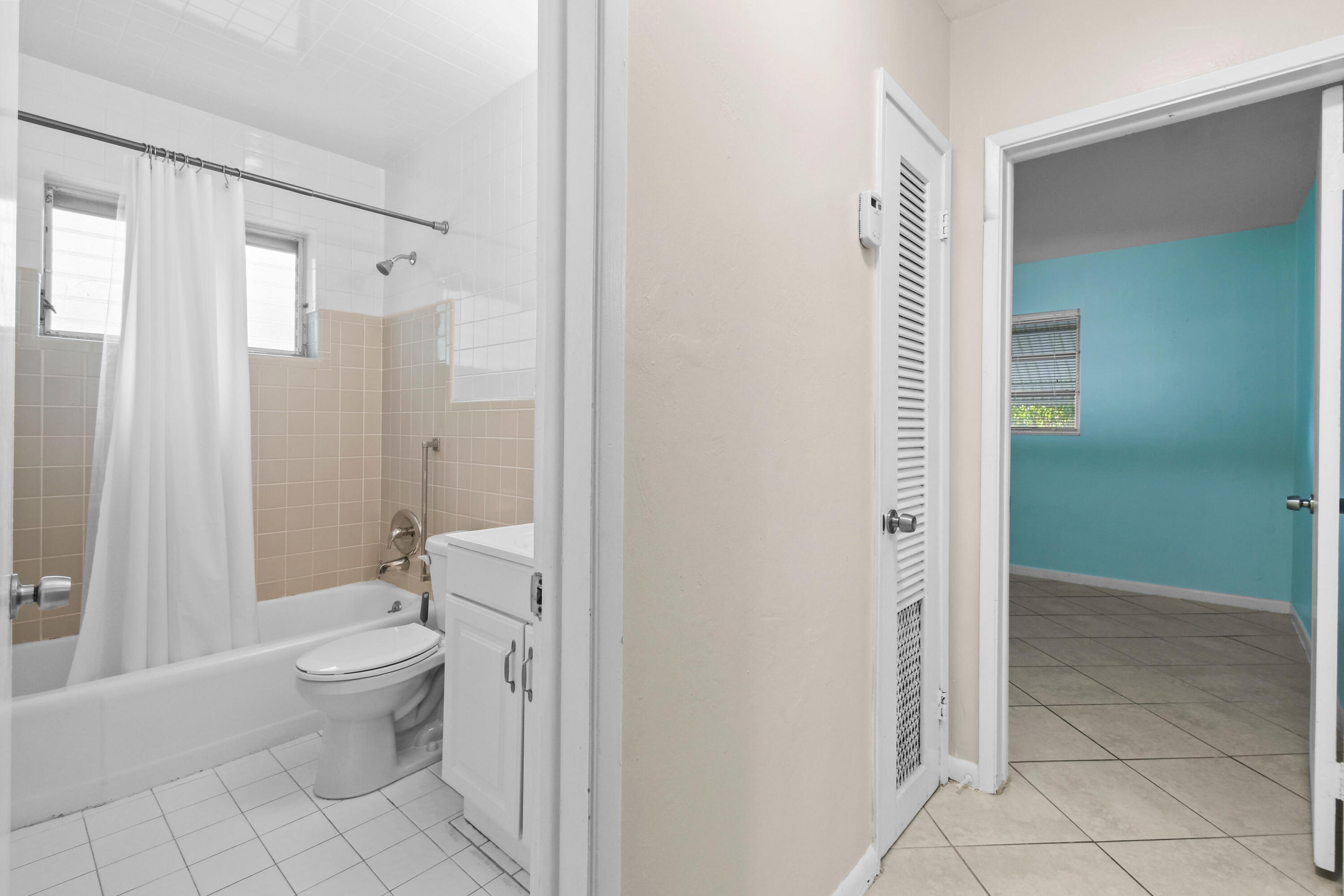 356 Cedar Avenue Tequesta, FL 33469 - Photo 34 of 51 a bathroom with a granite countertop toilet a sink and a mirror