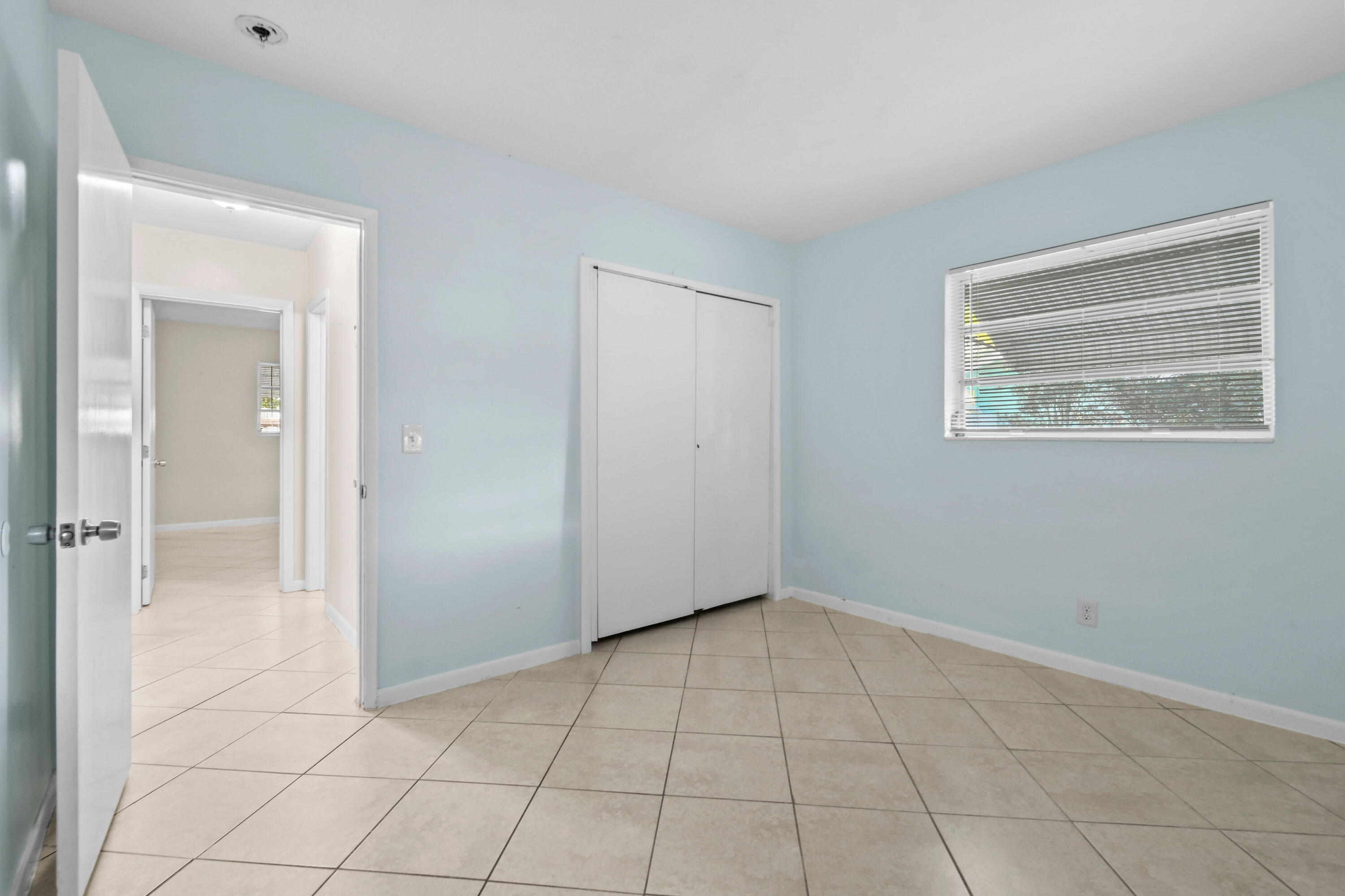 356 Cedar Avenue Tequesta, FL 33469 - Photo 38 of 51 an empty room with windows and closet