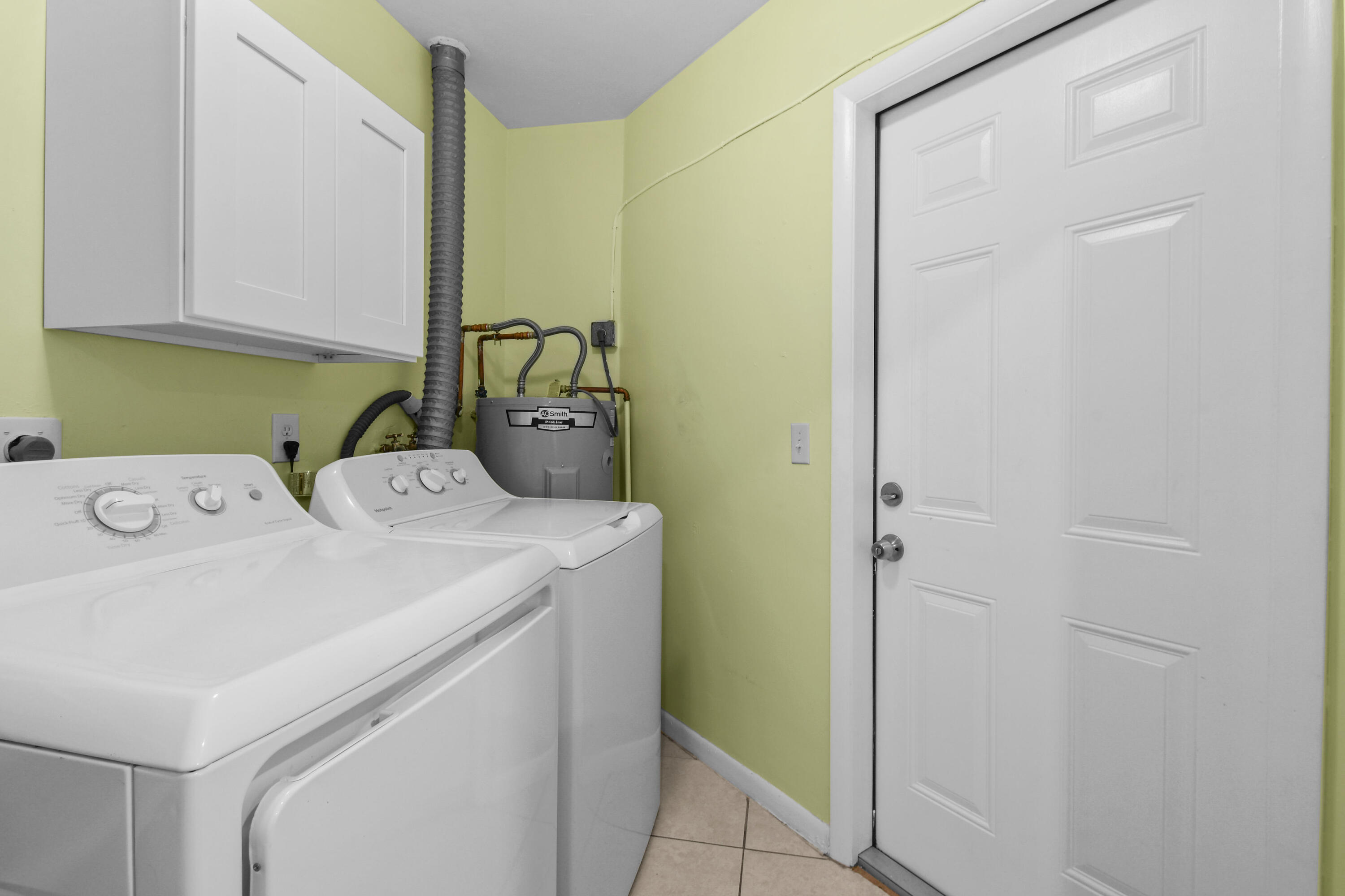 356 Cedar Avenue Tequesta, FL 33469 - Photo 40 of 51 a utility room with dryer and washer