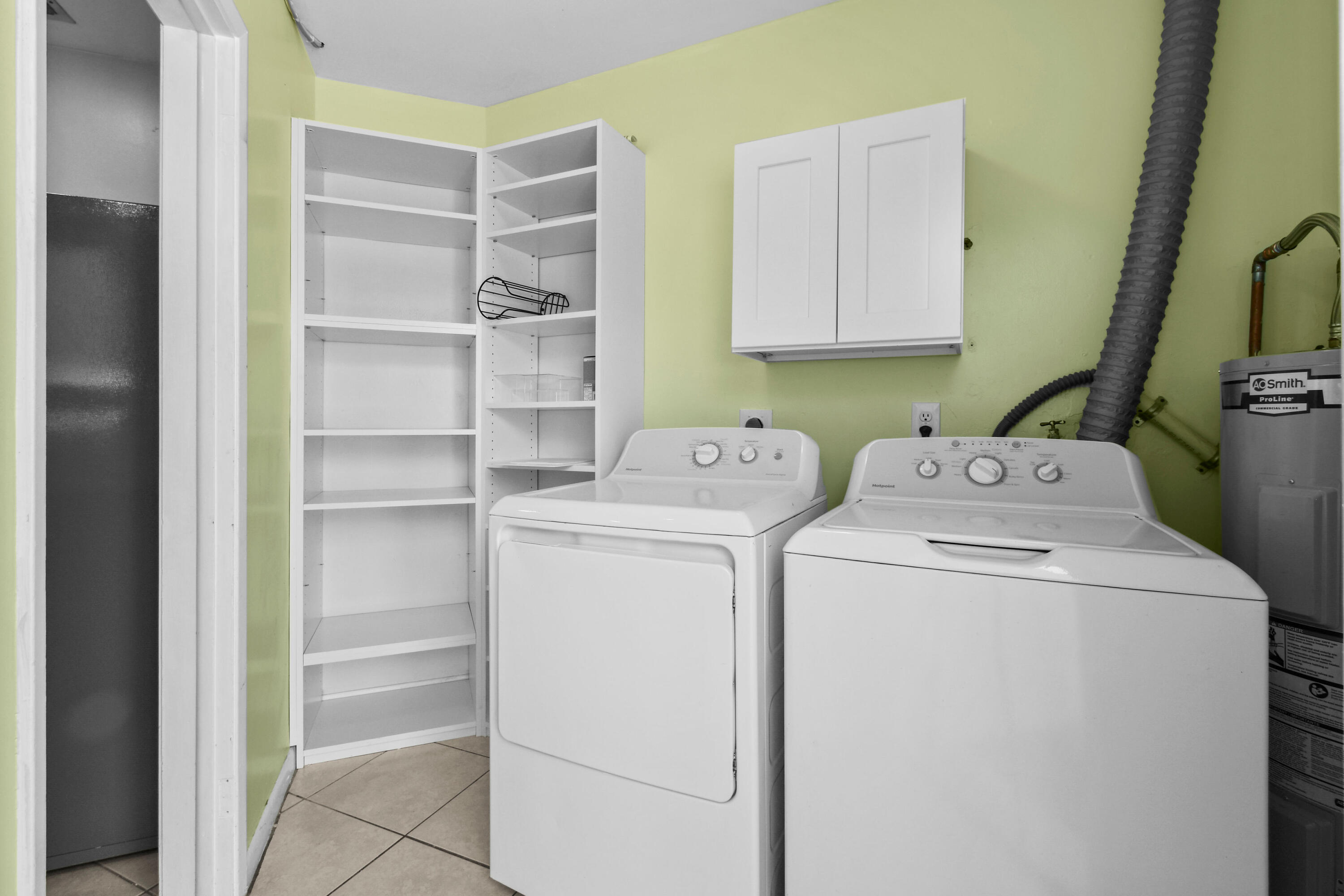 356 Cedar Avenue Tequesta, FL 33469 - Photo 41 of 51 a utility room with dryer and washer