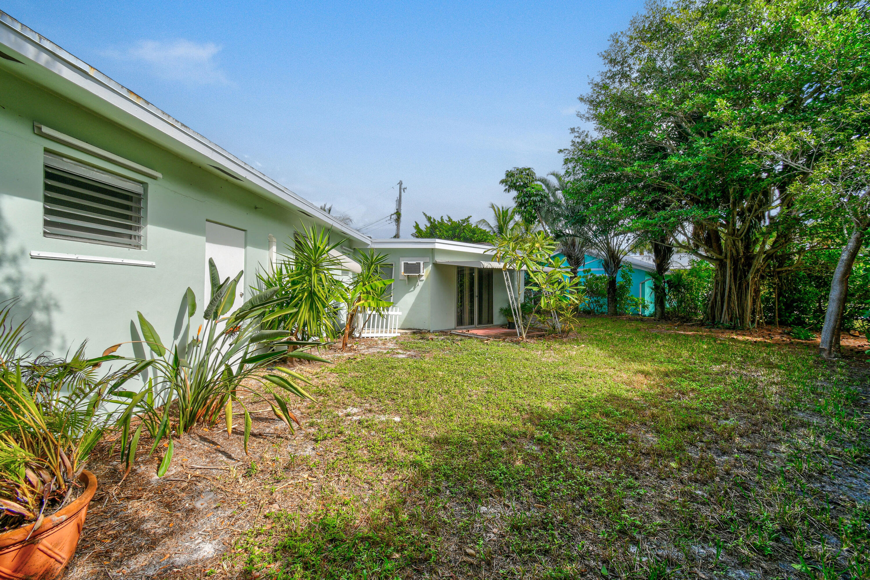 356 Cedar Avenue Tequesta, FL 33469 - Photo 48 of 51 a view of a house with a yard