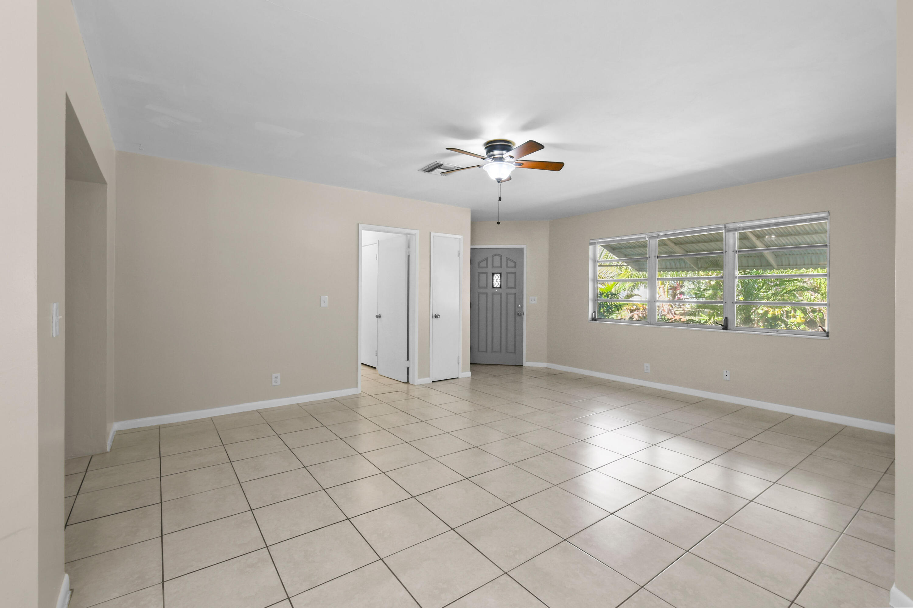 356 Cedar Avenue Tequesta, FL 33469 - Photo 9 of 51 a view of an empty room with a window
