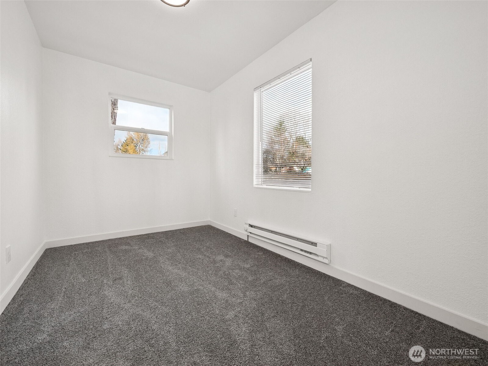 12535 Southeast Kent-Kangley Road Kent, WA 98030 - Photo 11 of 11 an empty room with windows