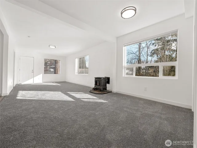 a room with a sink cabinets and wooden floor