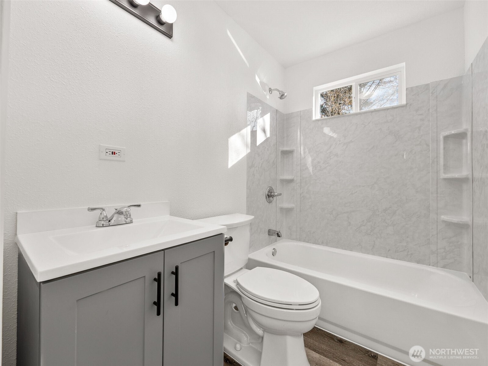 12535 Southeast Kent-Kangley Road Kent, WA 98030 - Photo 10 of 11 a bathroom with a sink a toilet and shower