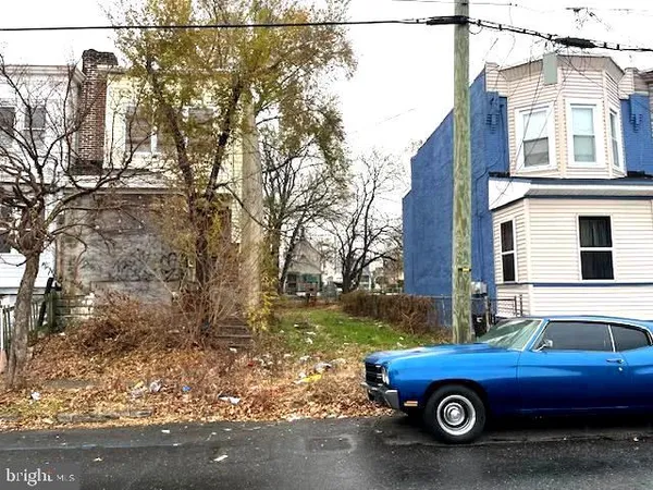 a car parked in front of a house
