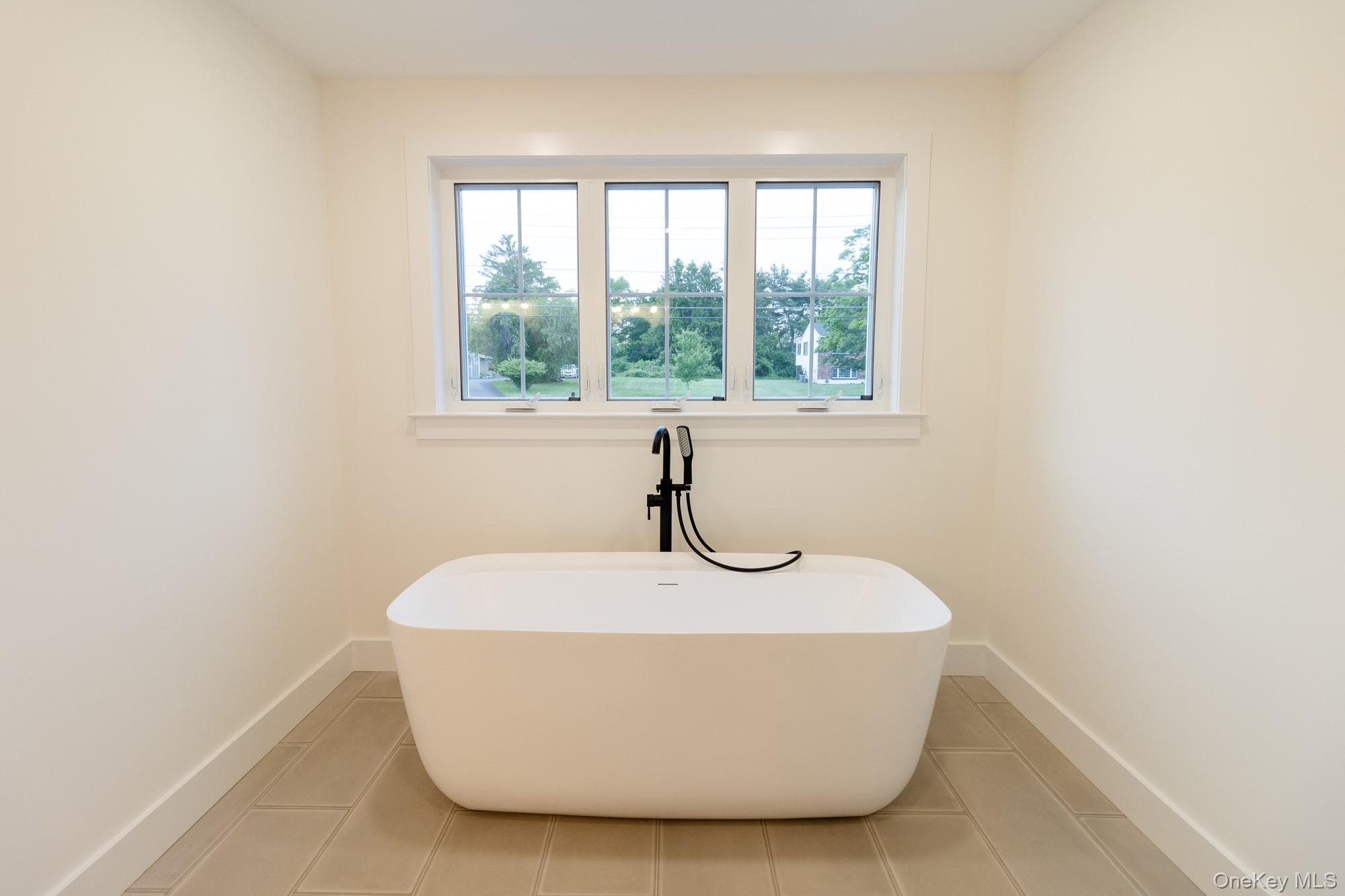 750 Ridgebury Road Slate Hill, NY 10973 - Photo 26 of 41 a white bath tub sitting in a bathroom