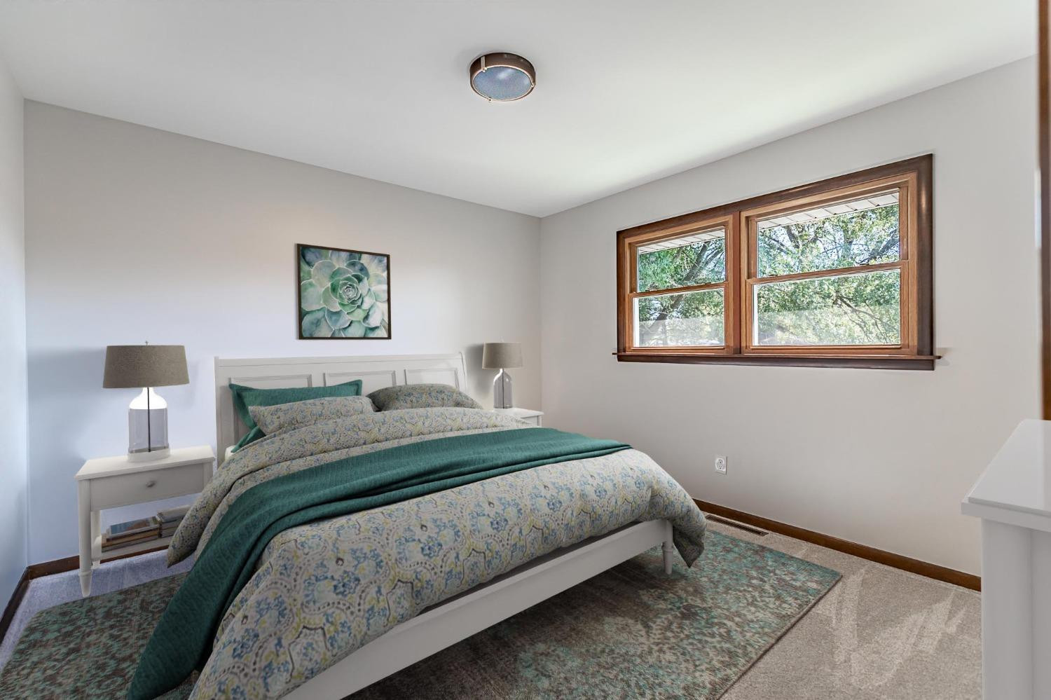 8551 Garfield Avenue Munster, IN 46321 - Photo 15 of 39 a bedroom with a bed and a window