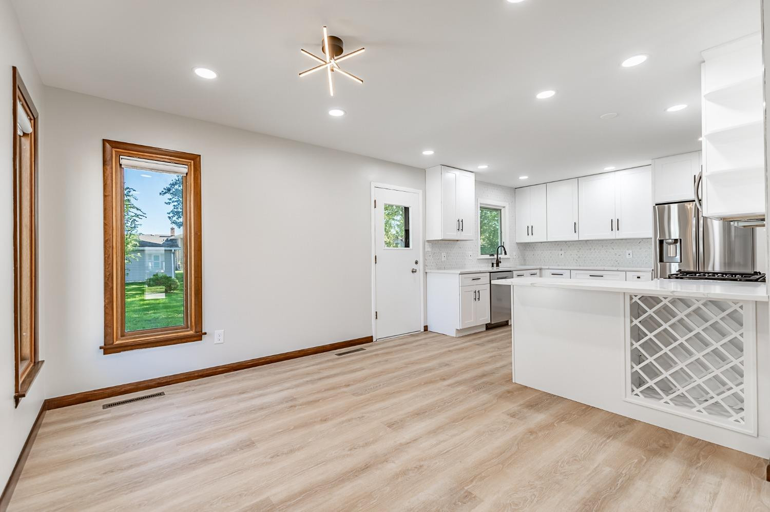 8551 Garfield Avenue Munster, IN 46321 - Photo 18 of 39 a kitchen with white cabinets and window