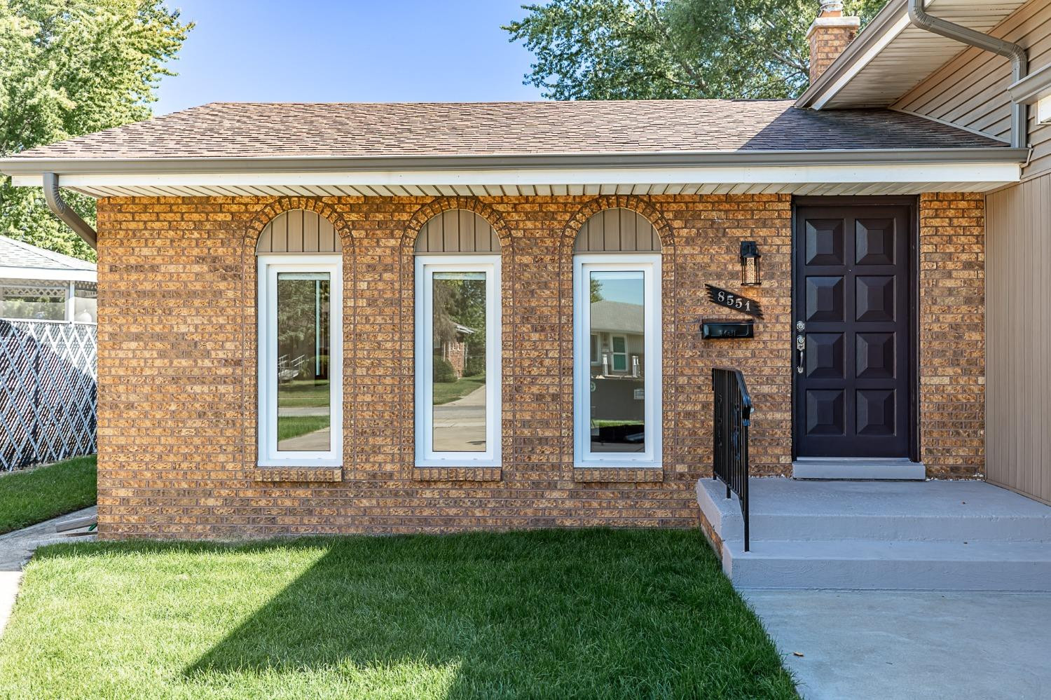 8551 Garfield Avenue Munster, IN 46321 - Photo 2 of 39 front view of a brick house with a yard