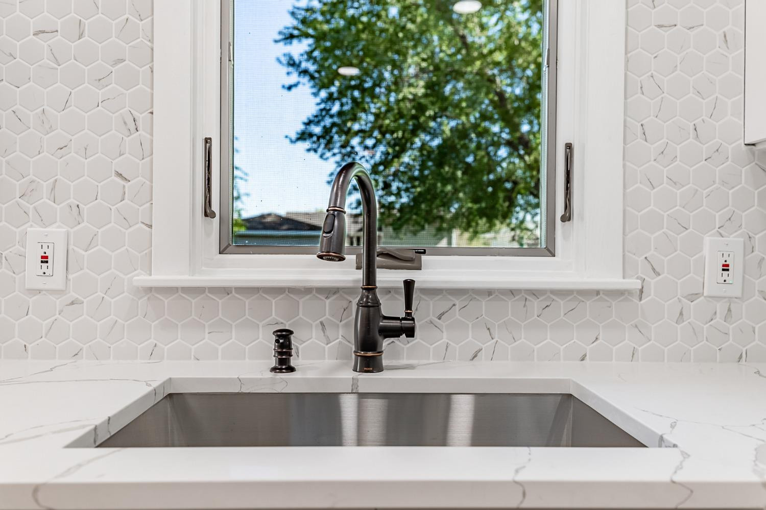 8551 Garfield Avenue Munster, IN 46321 - Photo 22 of 39 a bathroom with a sink and a window