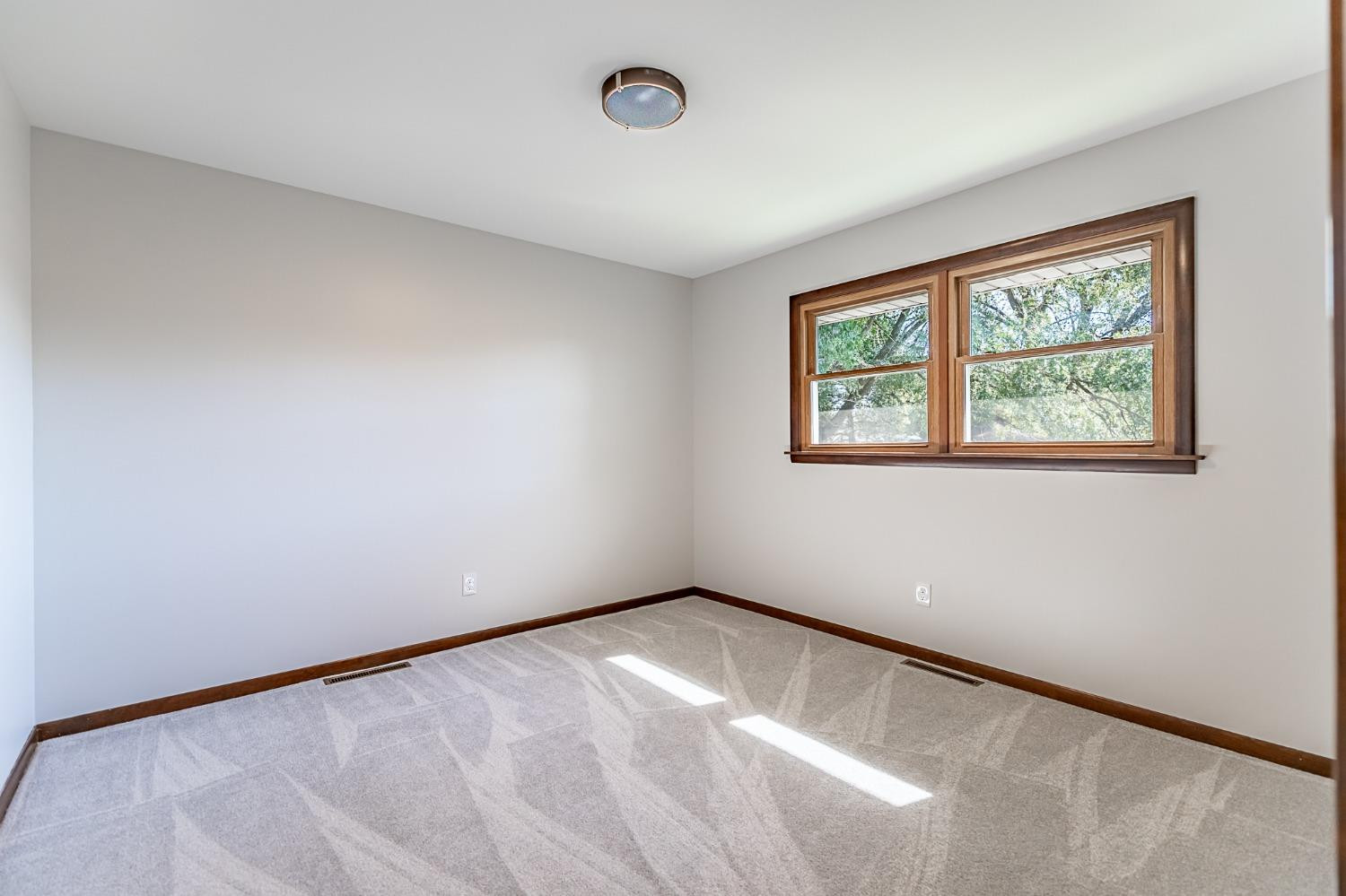 8551 Garfield Avenue Munster, IN 46321 - Photo 30 of 39 an empty room with a window