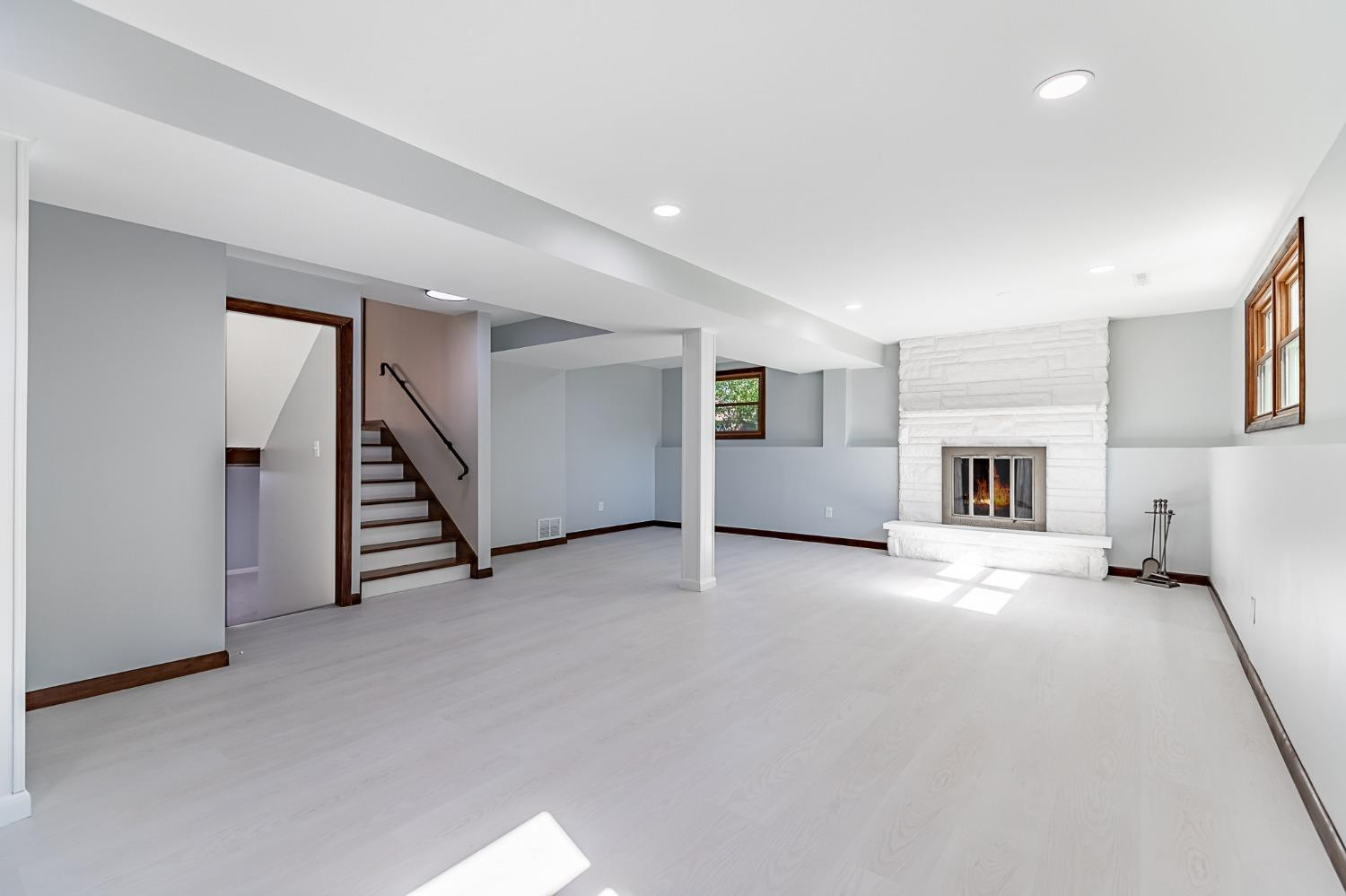 8551 Garfield Avenue Munster, IN 46321 - Photo 33 of 39 an empty room with a fireplace and white walls