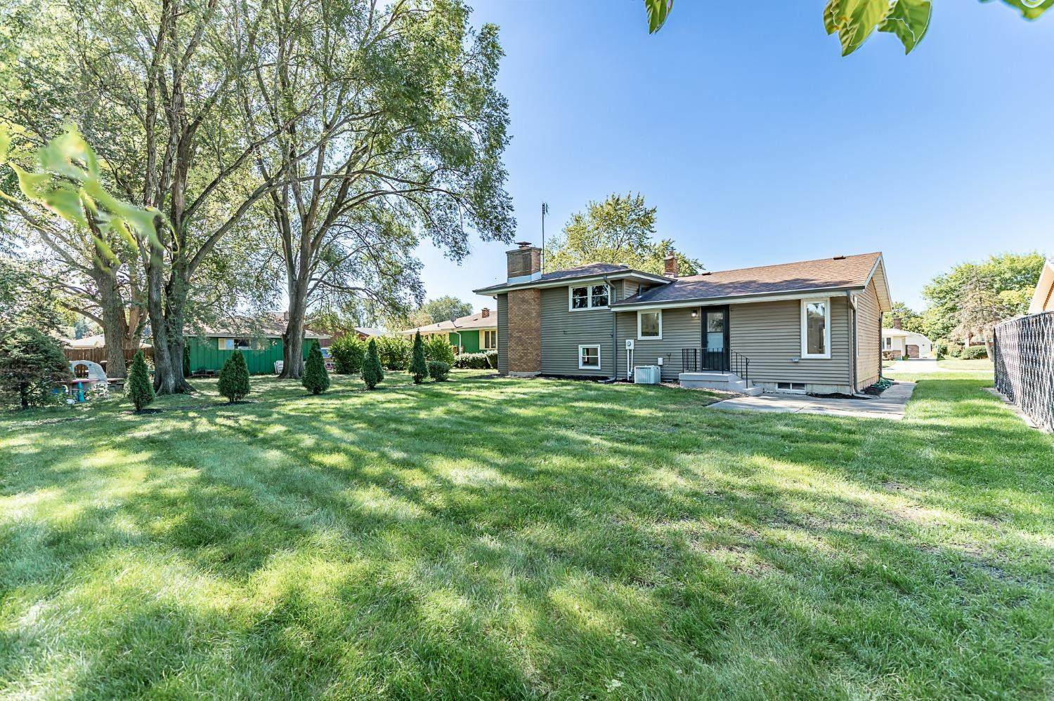 8551 Garfield Avenue Munster, IN 46321 - Photo 38 of 39 a front view of house with yard and green space