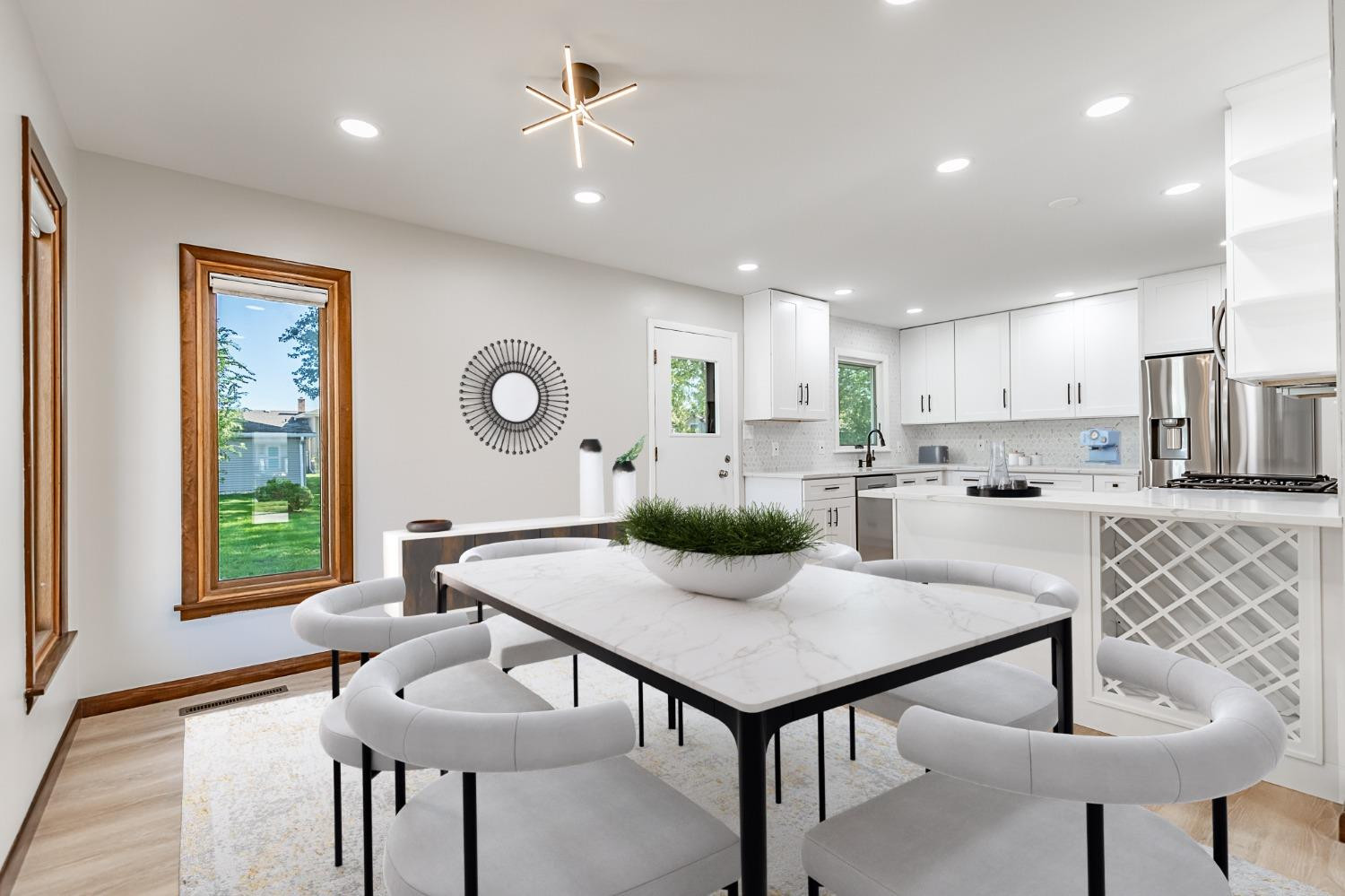 8551 Garfield Avenue Munster, IN 46321 - Photo 7 of 39 a kitchen with a dining table chairs and window