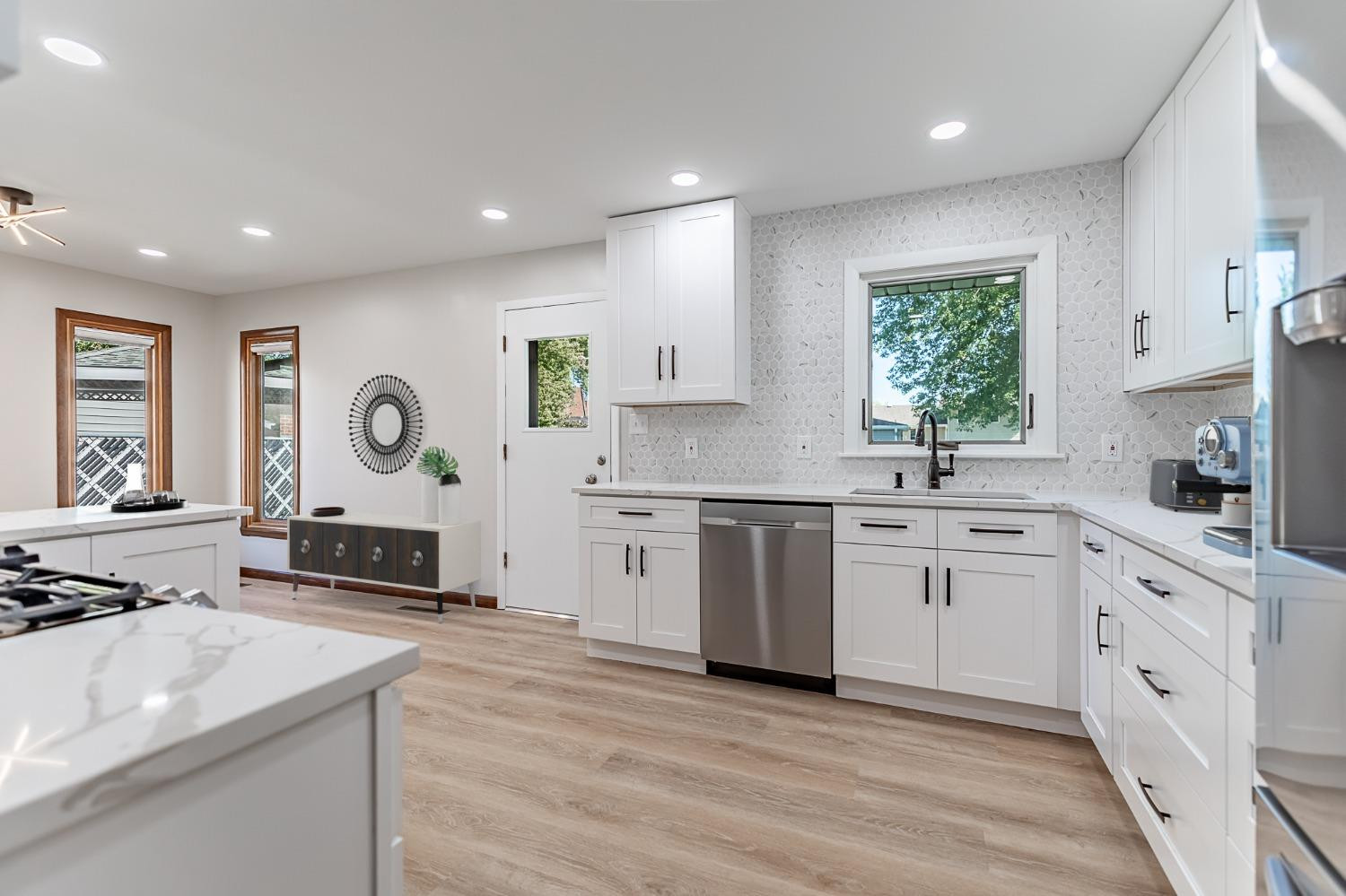 8551 Garfield Avenue Munster, IN 46321 - Photo 8 of 39 a kitchen with a sink stove and cabinets